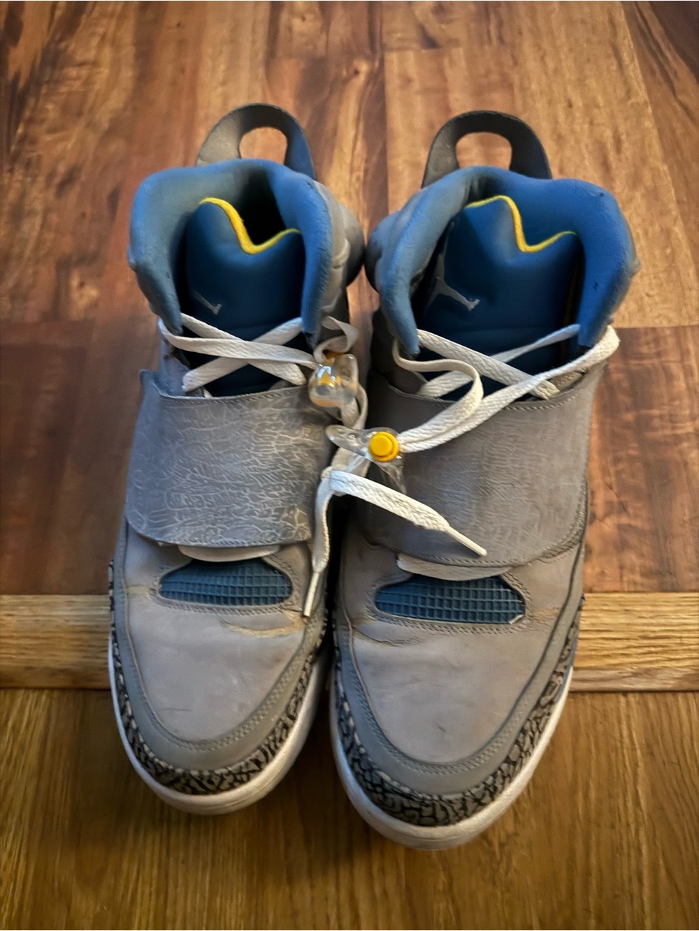 Gray and Blue Jordan Sneakers with Yellow Accent